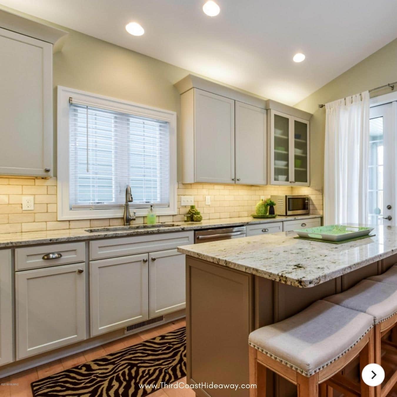 Kitchen with island and stainless appliances
