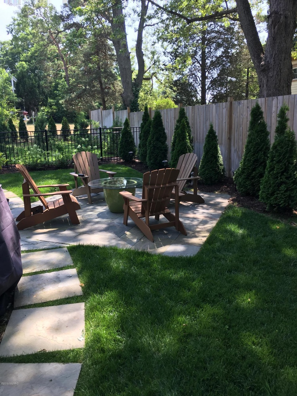 Backyard patio with Adirondack chairs